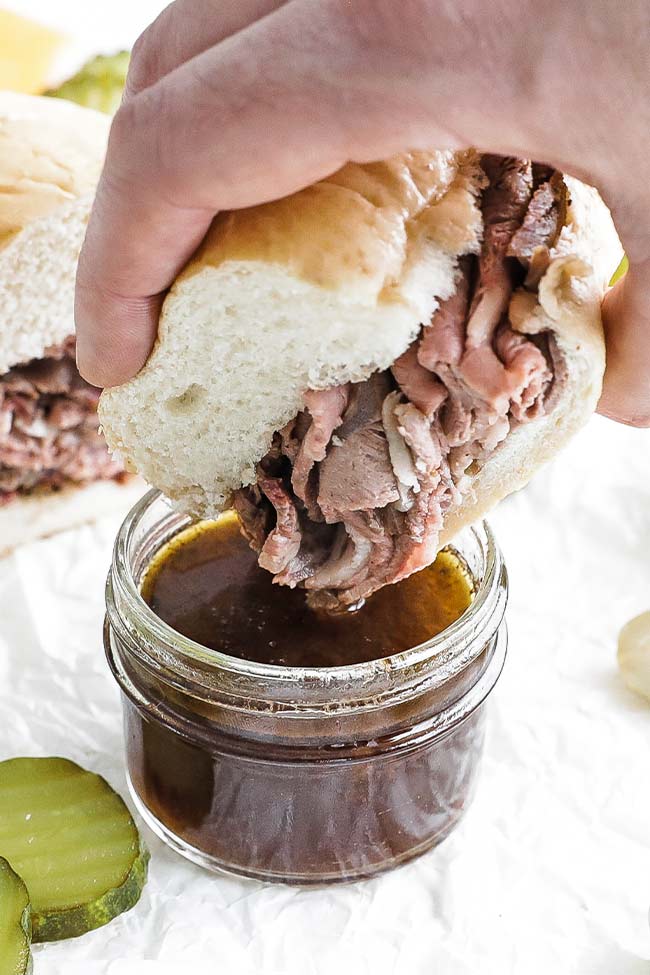 dipping a french dip into au jus