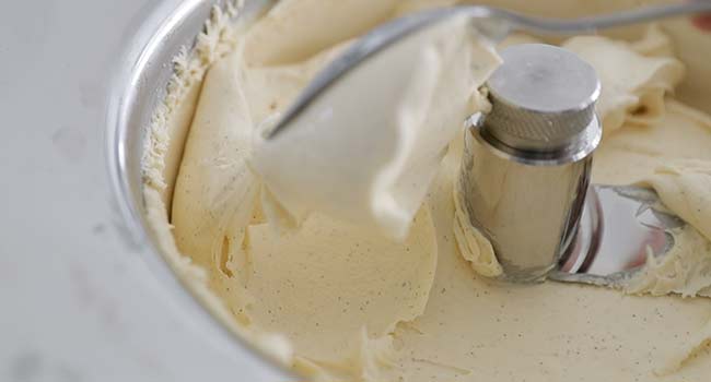 scooping vanilla ice cream