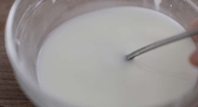 mixing together a slurry in a bowl