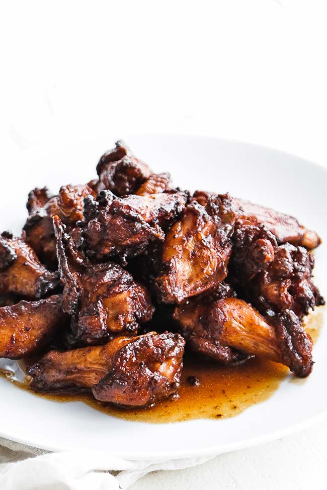 smoked chicken wings with bbq sauce on a plate