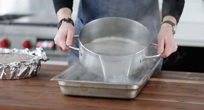 pouring hot water to a pan
