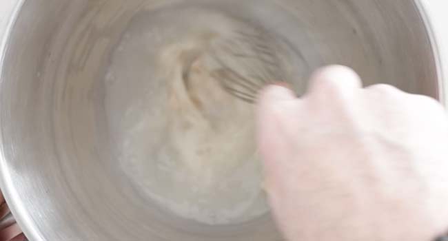 whisking yeast with water