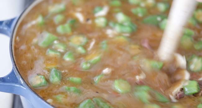 adding okra to a pot