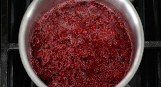 mashed raspberries in a pot