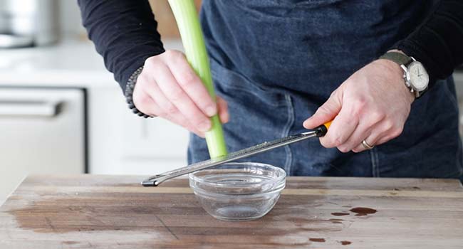 grating a rib of celery