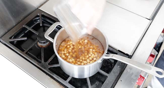 covering the chickpeas in a vegetable stock