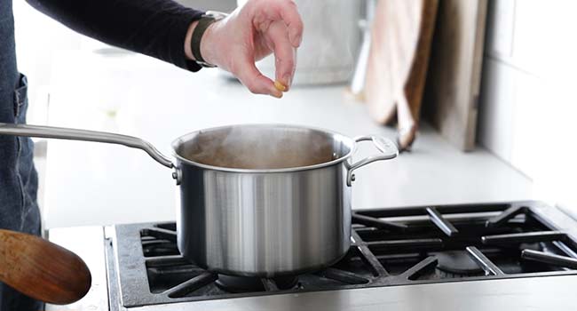 squishing a cooked chickpea