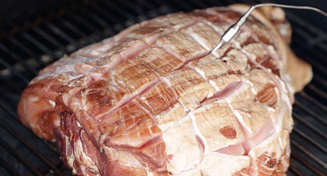 smoking a ham with a thermometer