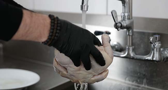 rinsing a whole chicken