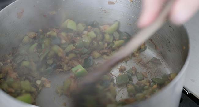 cooking peppers and onions