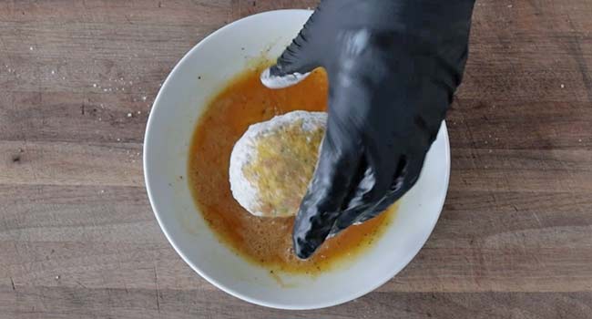 coating a scotch egg in egg wash