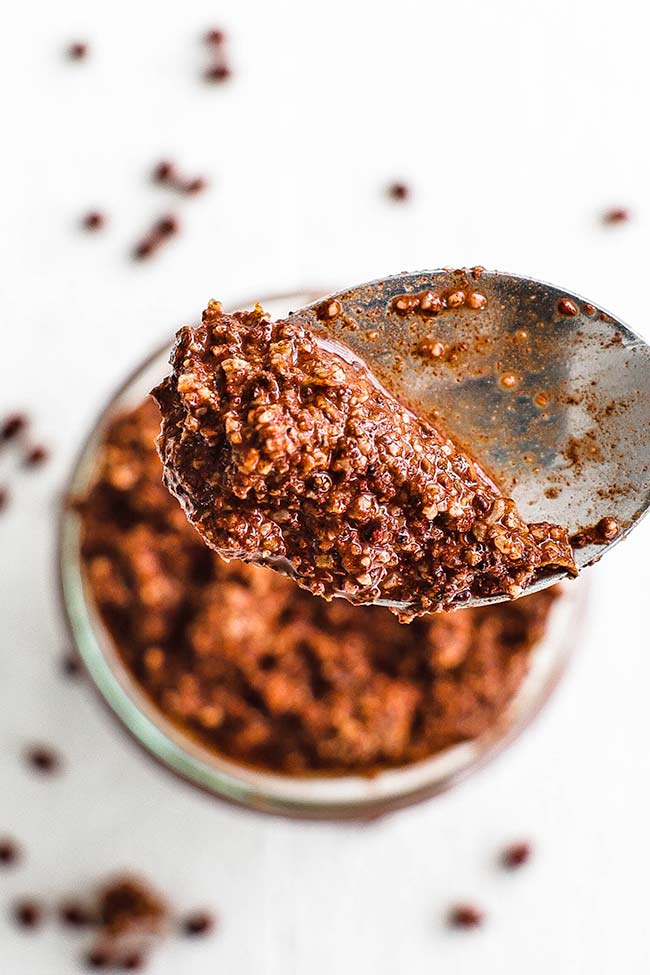 achiote paste in a jar and on a spoon