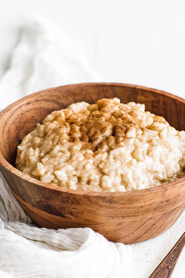 arroz con leche in a bowl with cinnamon