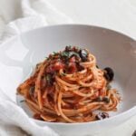 pasta puttanesca in a bowl