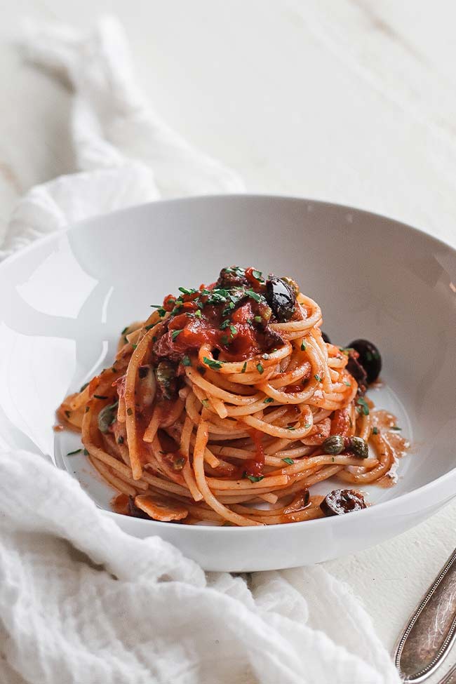 pasta puttanesca in a bowl