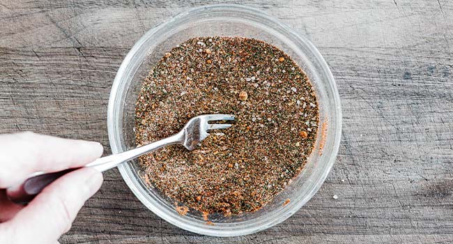 mixing together a seafood rub