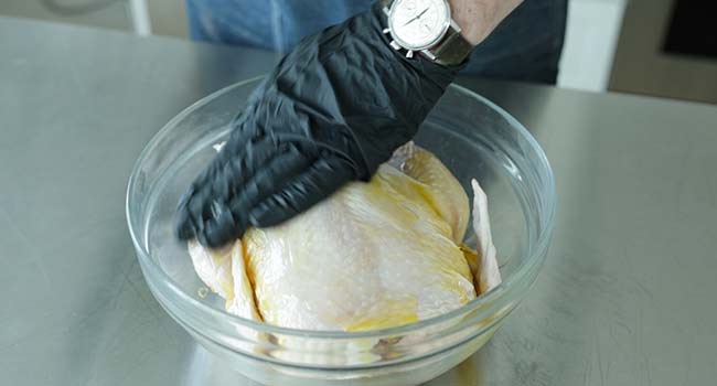 coating a chicken in oil