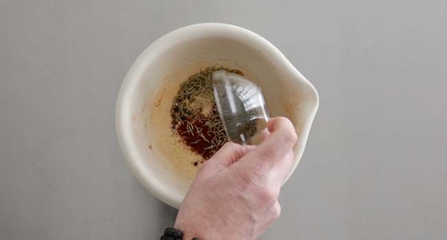 adding spices to a mortar