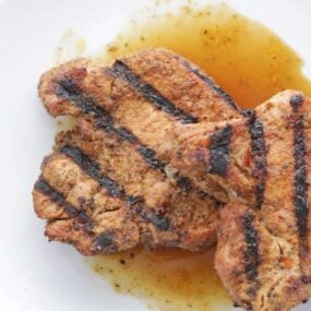 grilled pork chops on a plate