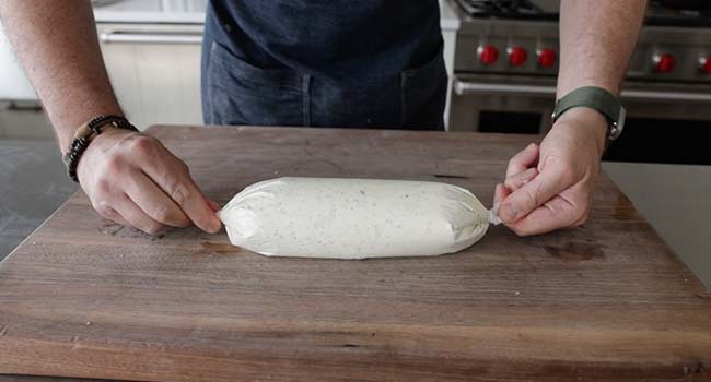 pinching the ends of parchment paper