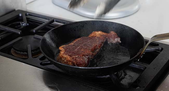 flipping over a steak