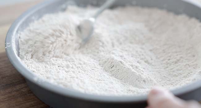 mixing flour with spices