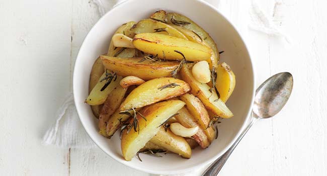 italian potatoes with rosemary in a bowl