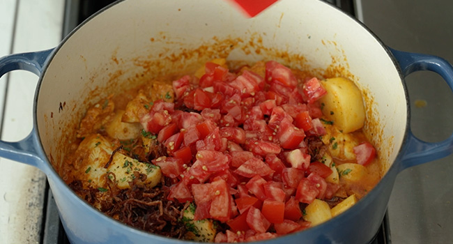tomatoes and potatoes in a pot
