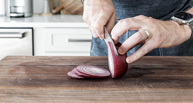 slicing red onions