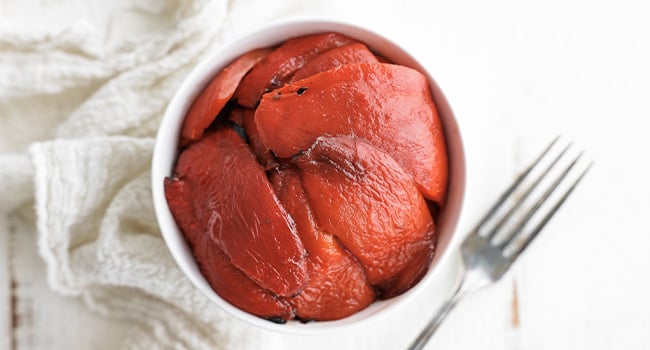 roasted red bell peppers in a bowl