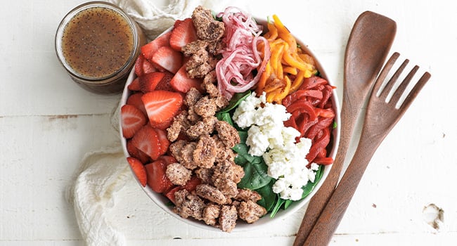 strawberry salad with spinach, peppers, onions, and cheese