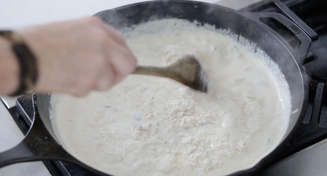 stirring cream in a pan