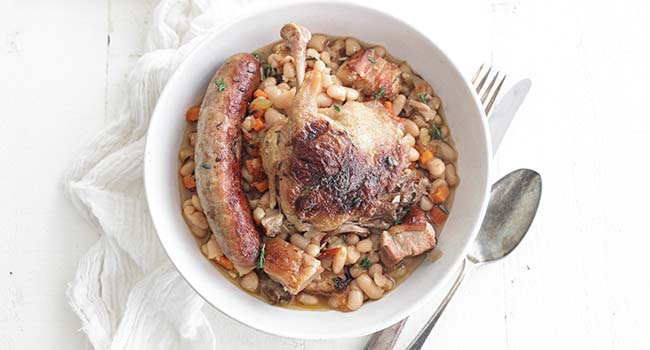 duck confit with sausage and beans