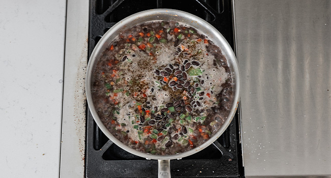 boiling black beans and peppers