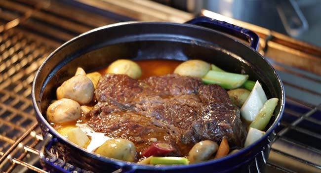 vegetables with a pot roast in the oven