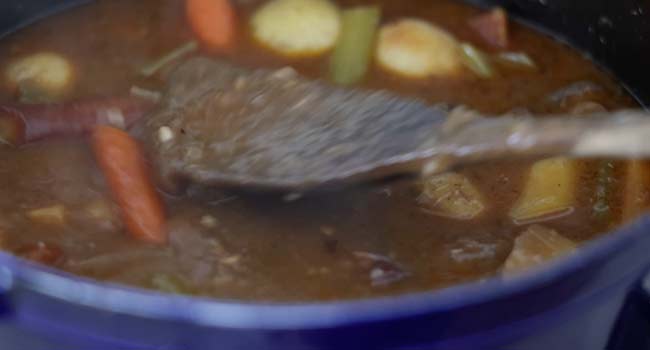 thick gravy with veggies in a pot