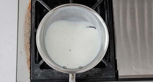 scalded pot of milk and vanilla beans
