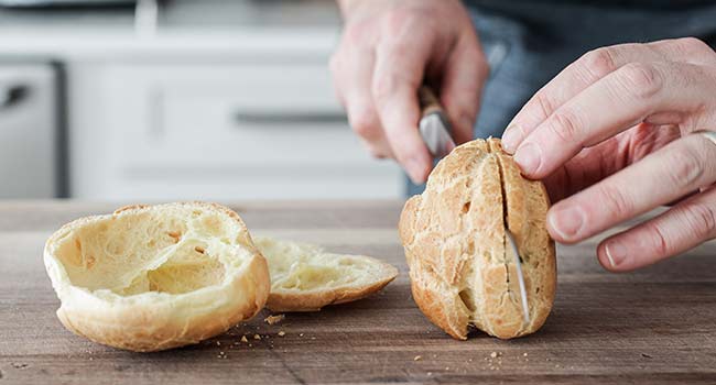 slicing cream puffs in half