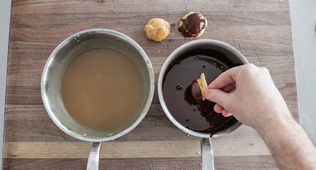 dipping profiteroles in chocolate