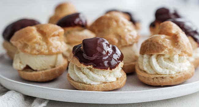 chocolate and caramel topped profiteroles