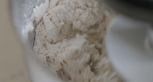 mixing pizza dough
