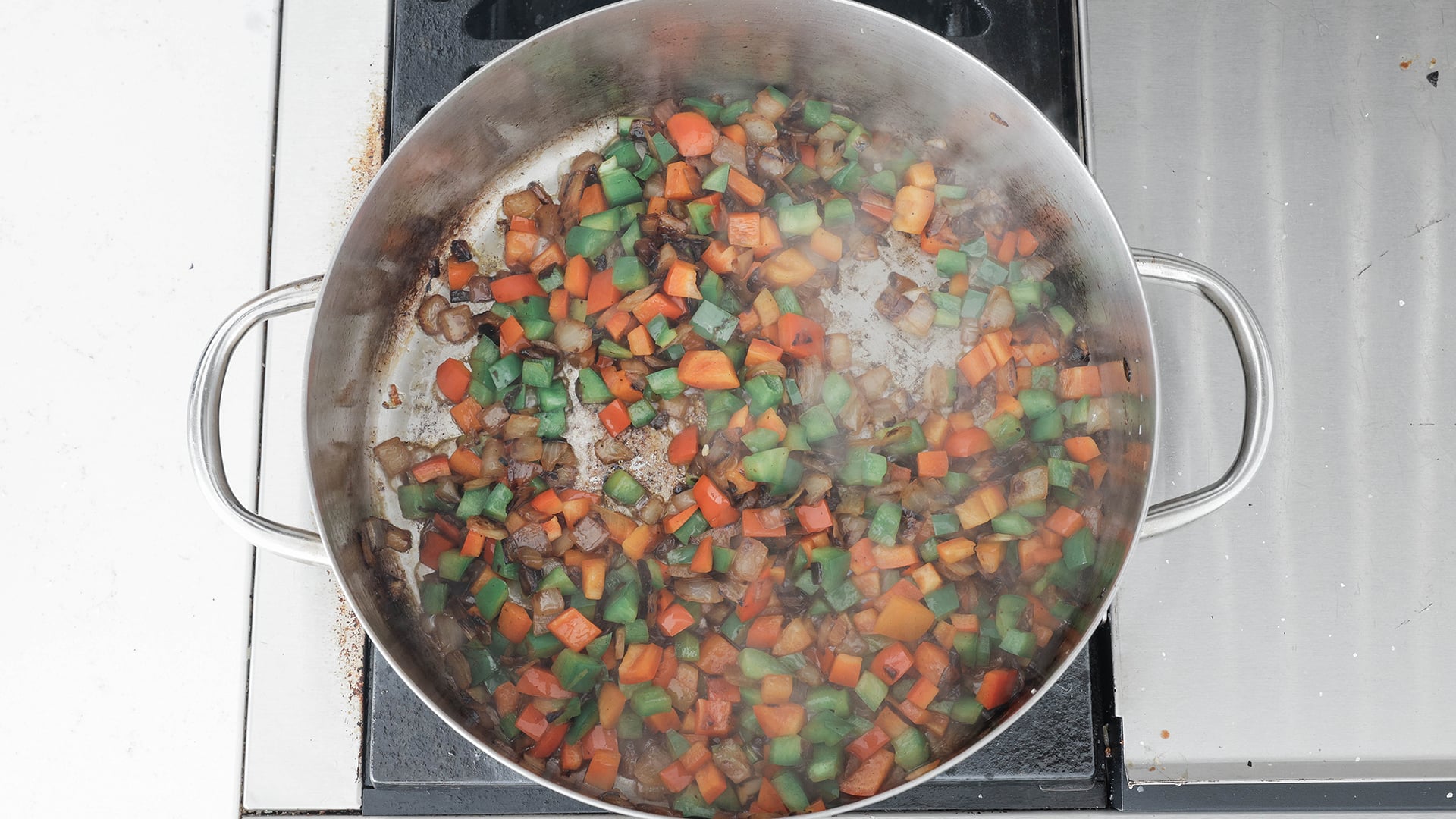 cooking peppers and onions