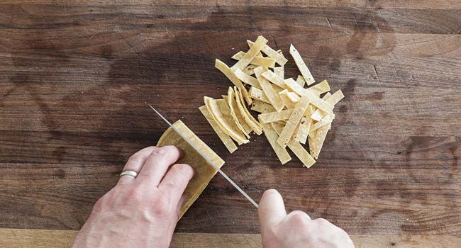 cutting corn tortillas