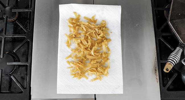 draining fried corn tortilla strips