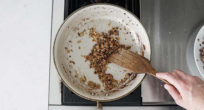 caramelizing onions and garlic in a pan