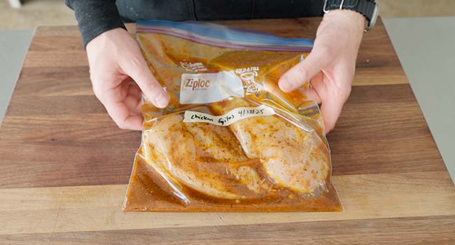chicken in marinade in a bag