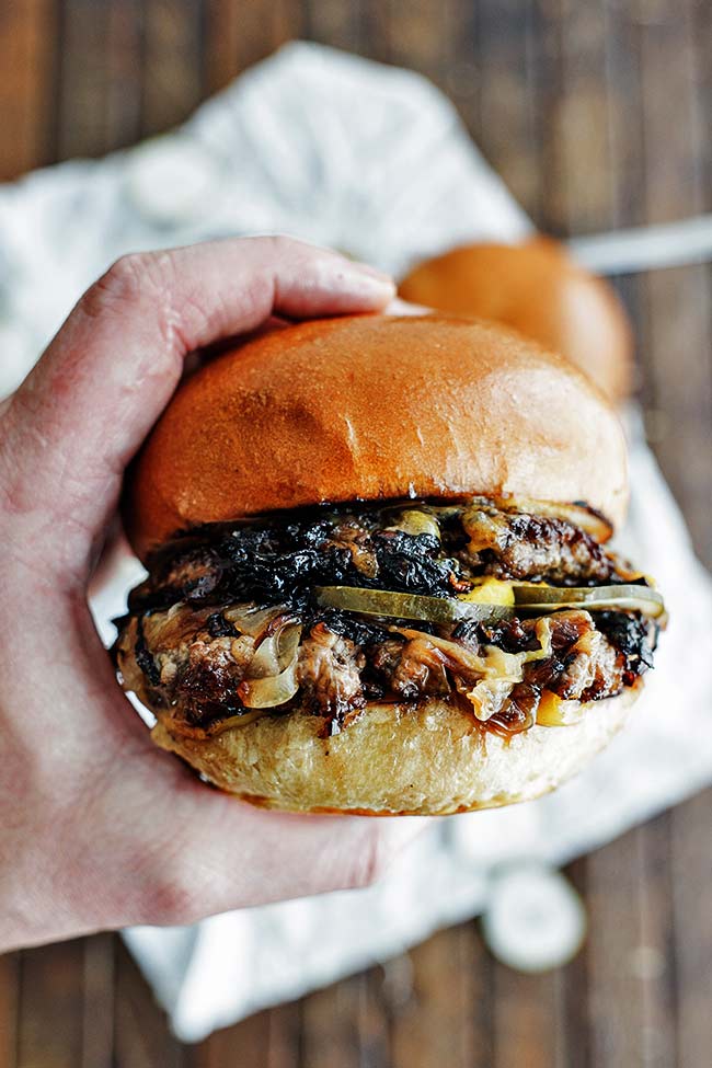 oklahoma onion burger in hand