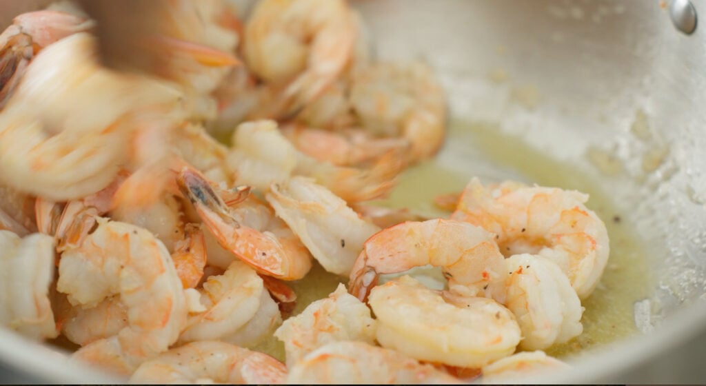 searing shrimp in a pan