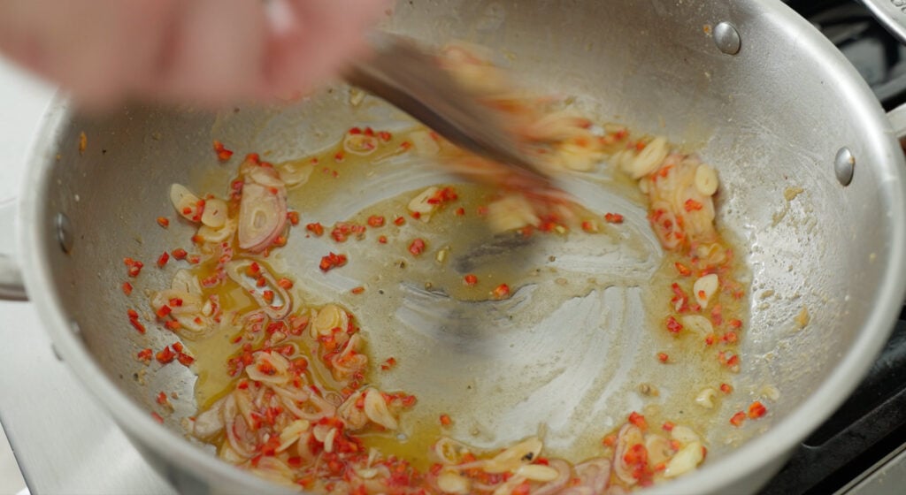 Sautéing aromatics in a pan