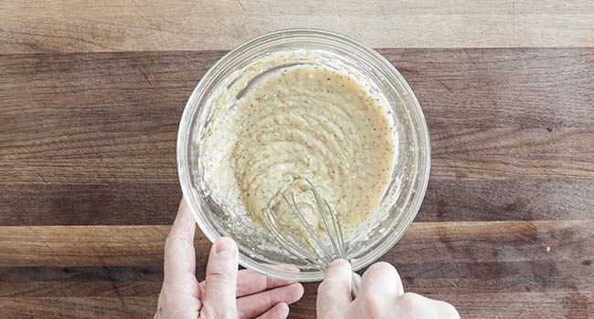 whisking a dijon sauce together